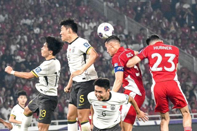 1749391923597029446.jpg (体育)(5)足球——世预赛:中国队不敌印尼队XxjpseC007077_20250606_PEPFN0A001.jpg